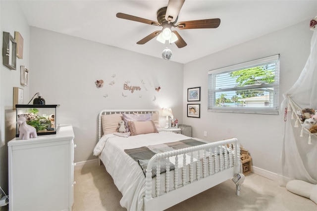13749 80th Ave, Seminole, FL 33776 - bedroom with baseboards, light colored carpet, and ceiling fan