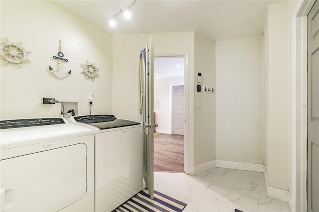 13749 80th Ave, Seminole, FL 33776 - laundry room featuring laundry area, marble finish floor, baseboards, and washing machine and clothes dryer