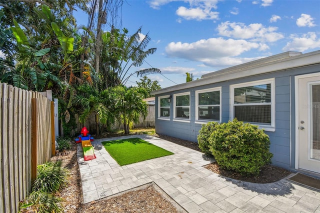 13749 80th Ave, Seminole, FL 33776 - view of yard with a fenced backyard and a patio area