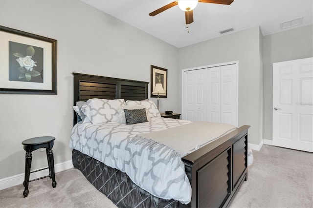 bedroom with visible vents, carpet floors, and a closet