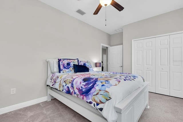 bedroom with visible vents, carpet, ceiling fan, and a closet