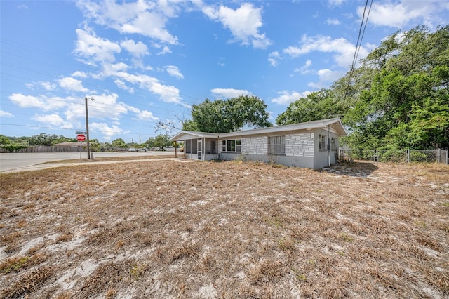 view of front of house with fence