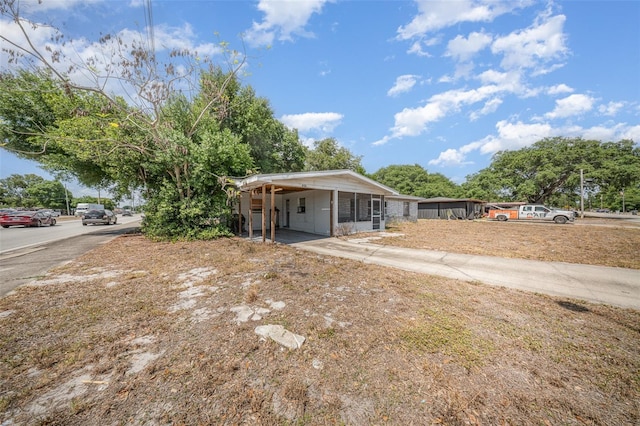 bungalow-style house featuring a carport
