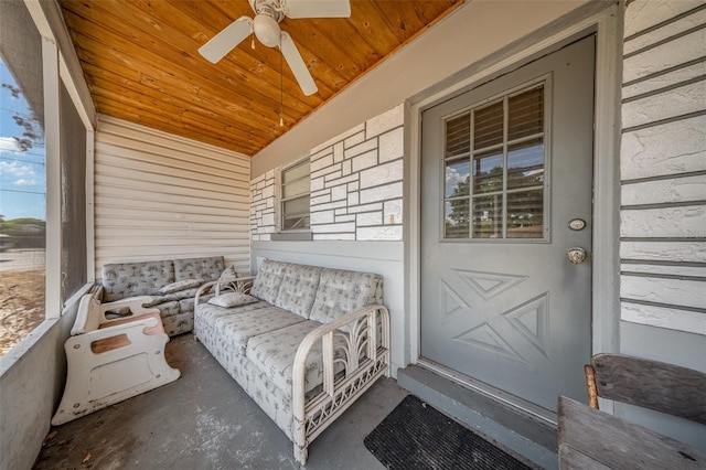 sunroom featuring ceiling fan
