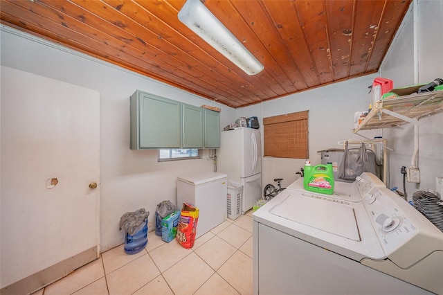 washroom with cabinet space, independent washer and dryer, light tile patterned floors, and wood ceiling