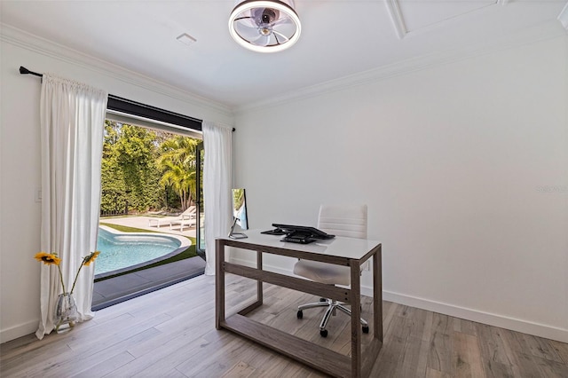 office with crown molding, baseboards, and wood finished floors