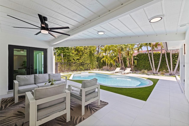 view of swimming pool featuring outdoor lounge area, a fenced backyard, french doors, a ceiling fan, and a patio