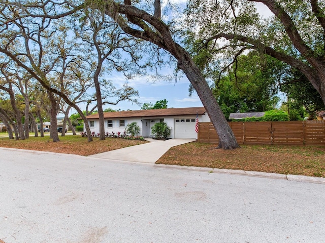 1700 25th St N, Saint Petersburg, FL 33713 - ranch-style house featuring a garage, fence, and concrete driveway