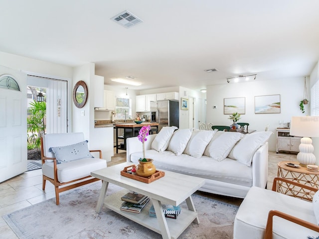 1700 25th St N, Saint Petersburg, FL 33713 - living area with light tile patterned flooring and visible vents