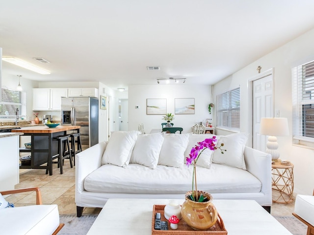 1700 25th St N, Saint Petersburg, FL 33713 - living area featuring light tile patterned floors and visible vents