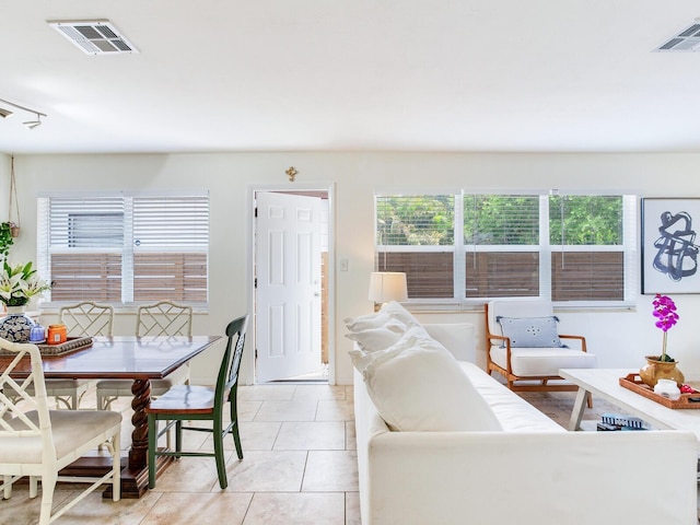 1700 25th St N, Saint Petersburg, FL 33713 - living room featuring visible vents and light tile patterned floors