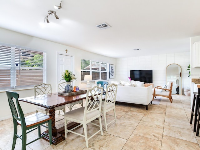 1700 25th St N, Saint Petersburg, FL 33713 - dining area featuring tile walls, light tile patterned flooring, and visible vents