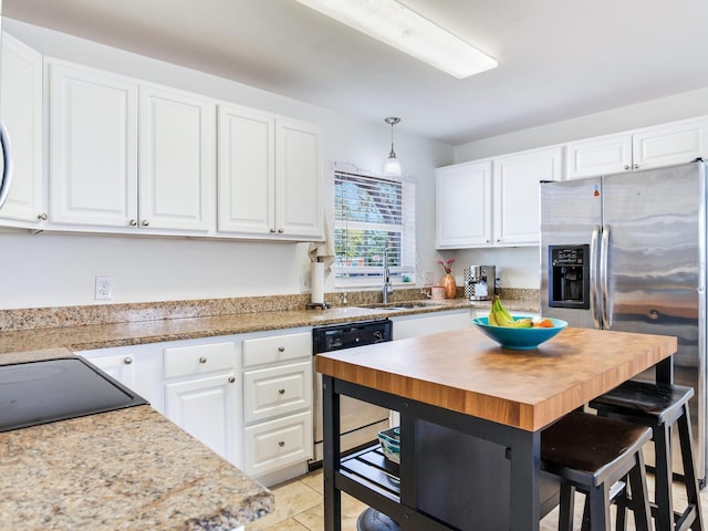 1700 25th St N, Saint Petersburg, FL 33713 - kitchen featuring a sink, white cabinetry, black dishwasher, and stainless steel fridge with ice dispenser