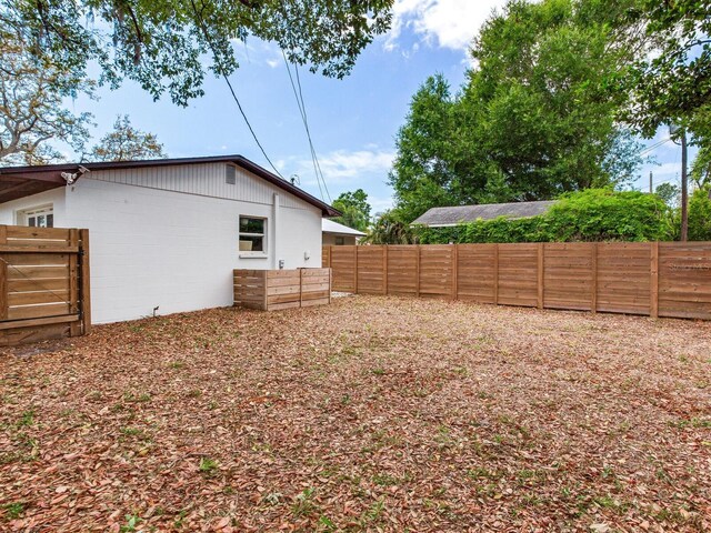 1700 25th St N, Saint Petersburg, FL 33713 - view of yard with a fenced backyard