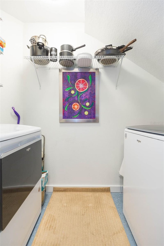 10473 Villa View Cir, Tampa, FL 33647 - clothes washing area featuring washer and dryer, laundry area, and baseboards
