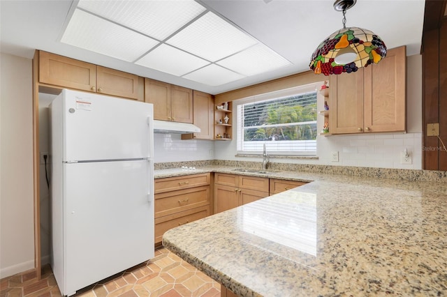 kitchen featuring open shelves, white appliances, under cabinet range hood, a sink, and backsplash