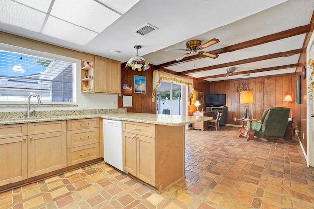 kitchen featuring dishwasher, wood walls, a peninsula, beamed ceiling, and visible vents
