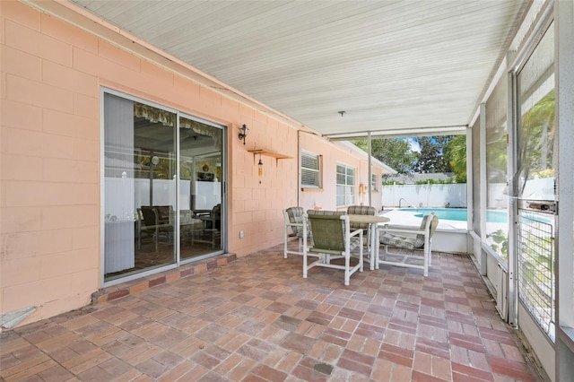sunroom / solarium with outdoor dining space