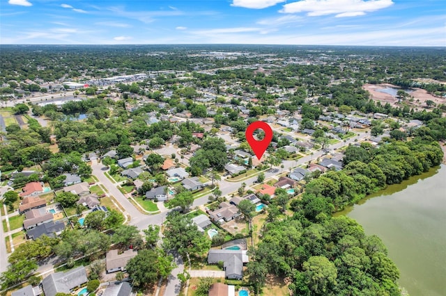 birds eye view of property with a water view and a residential view