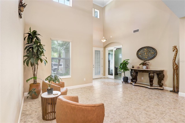 3243 Watermark Dr, Wesley Chapel, FL 33544 - sitting room featuring a towering ceiling, baseboards, visible vents, and tile patterned floors