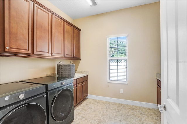 3243 Watermark Dr, Wesley Chapel, FL 33544 - laundry room featuring cabinet space, washer and clothes dryer, and baseboards