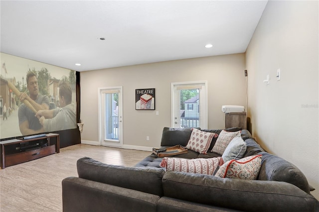3243 Watermark Dr, Wesley Chapel, FL 33544 - living room with recessed lighting, baseboards, and wood finished floors