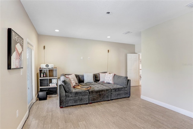 3243 Watermark Dr, Wesley Chapel, FL 33544 - living room featuring baseboards, recessed lighting, and light wood-type flooring
