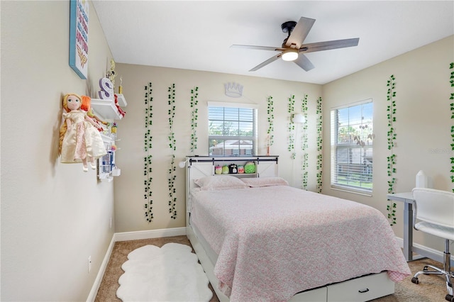 3243 Watermark Dr, Wesley Chapel, FL 33544 - carpeted bedroom featuring baseboards, multiple windows, and ceiling fan
