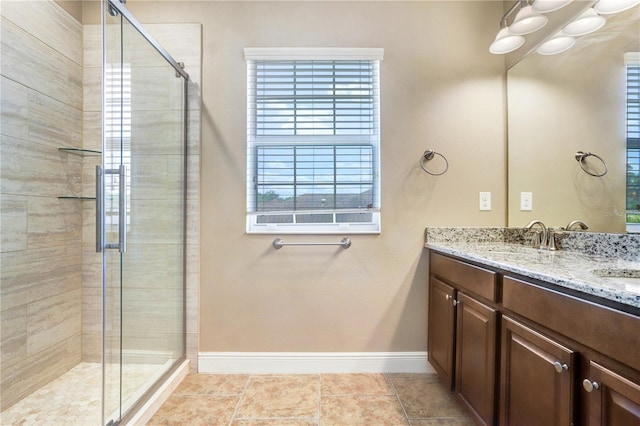 3243 Watermark Dr, Wesley Chapel, FL 33544 - bathroom featuring a sink, a stall shower, an inviting chandelier, double vanity, and baseboards