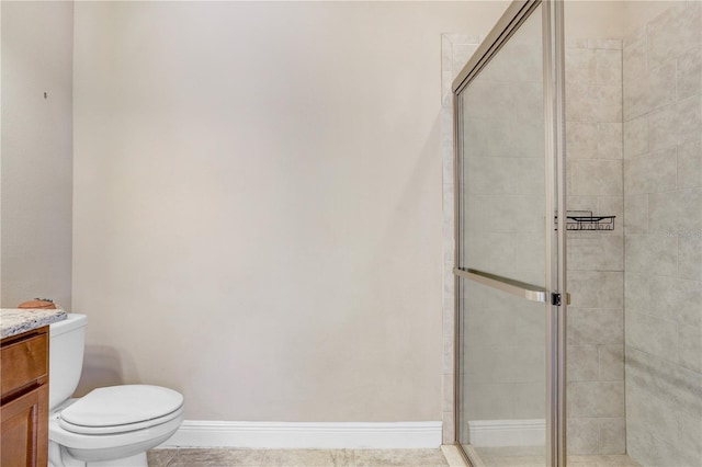3243 Watermark Dr, Wesley Chapel, FL 33544 - bathroom featuring a stall shower, vanity, toilet, and baseboards