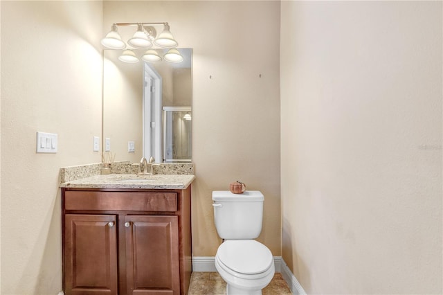 3243 Watermark Dr, Wesley Chapel, FL 33544 - bathroom featuring toilet, baseboards, vanity, and tile patterned flooring