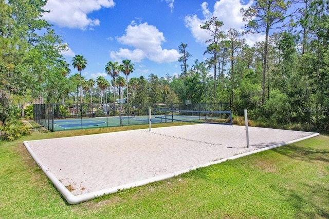 3243 Watermark Dr, Wesley Chapel, FL 33544 - view of property's community featuring a yard, a tennis court, volleyball court, fence, and community basketball court