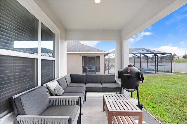 view of patio / terrace with outdoor lounge area, a lanai, and a swimming pool