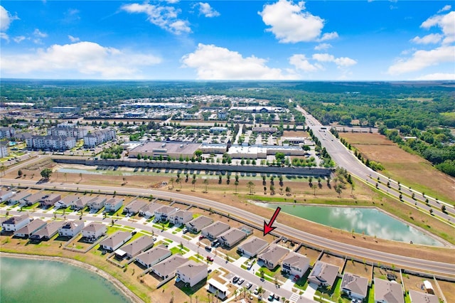 bird's eye view with a water view and a residential view