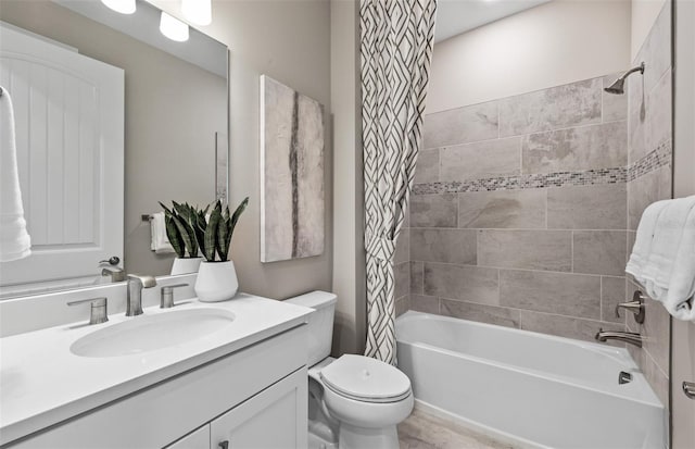 bathroom with toilet, shower / bath combo, and vanity