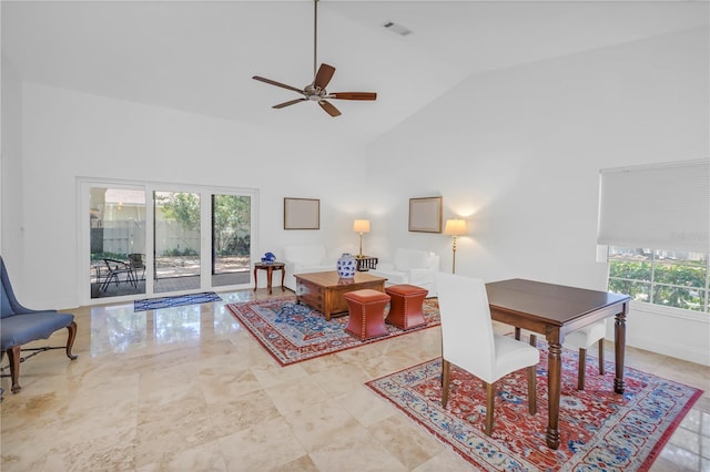 interior space featuring visible vents, a ceiling fan, and high vaulted ceiling