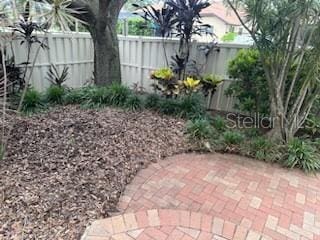 view of yard with a patio and fence
