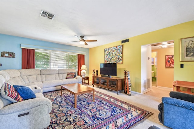 living area with visible vents, ceiling fan, and carpet floors