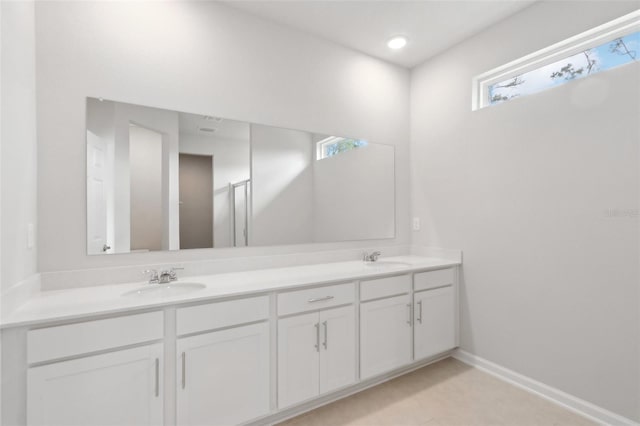 4086 Polynesia Rd, North Port, FL 34288 - bathroom featuring baseboards, double vanity, and a sink