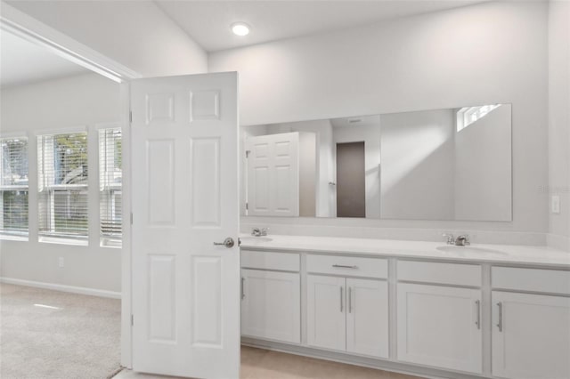 4086 Polynesia Rd, North Port, FL 34288 - bathroom with double vanity, a sink, and baseboards