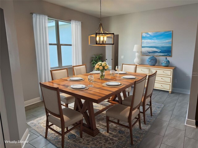 dining space with a notable chandelier and baseboards
