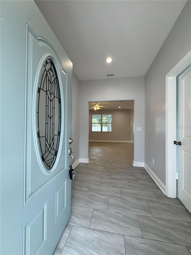 entrance foyer with baseboards, recessed lighting, visible vents, and a ceiling fan