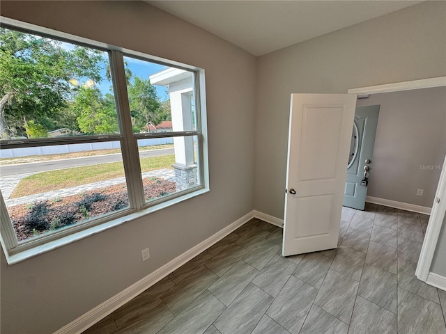 empty room featuring baseboards