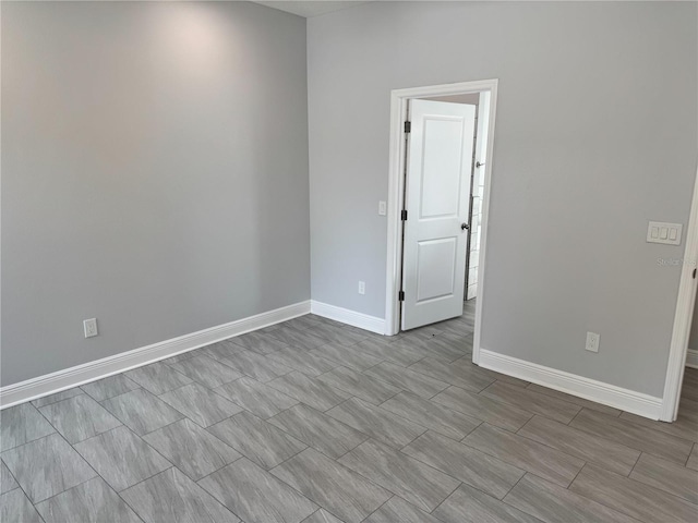 empty room with baseboards