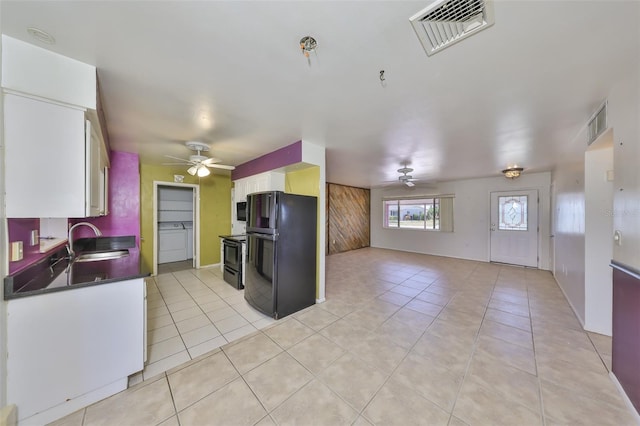 kitchen featuring visible vents, ceiling fan, a sink, light tile patterned floors, and black appliances