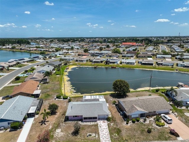 aerial view with a residential view and a water view