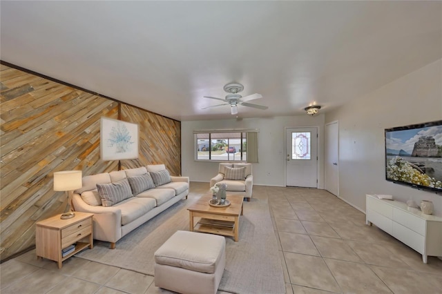 living area featuring a ceiling fan and light tile patterned floors
