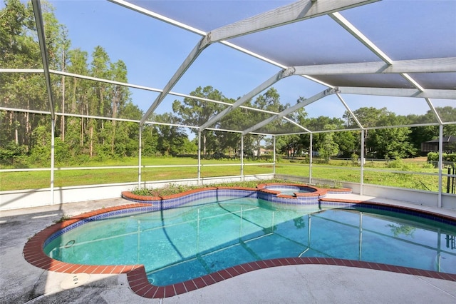 view of pool with a yard, a pool with connected hot tub, and a lanai
