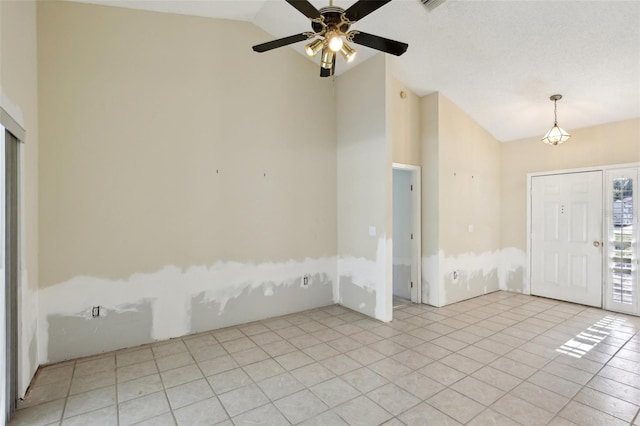 unfurnished room featuring light tile patterned floors, lofted ceiling, and ceiling fan