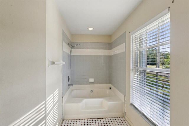 full bathroom with baseboards and bathtub / shower combination